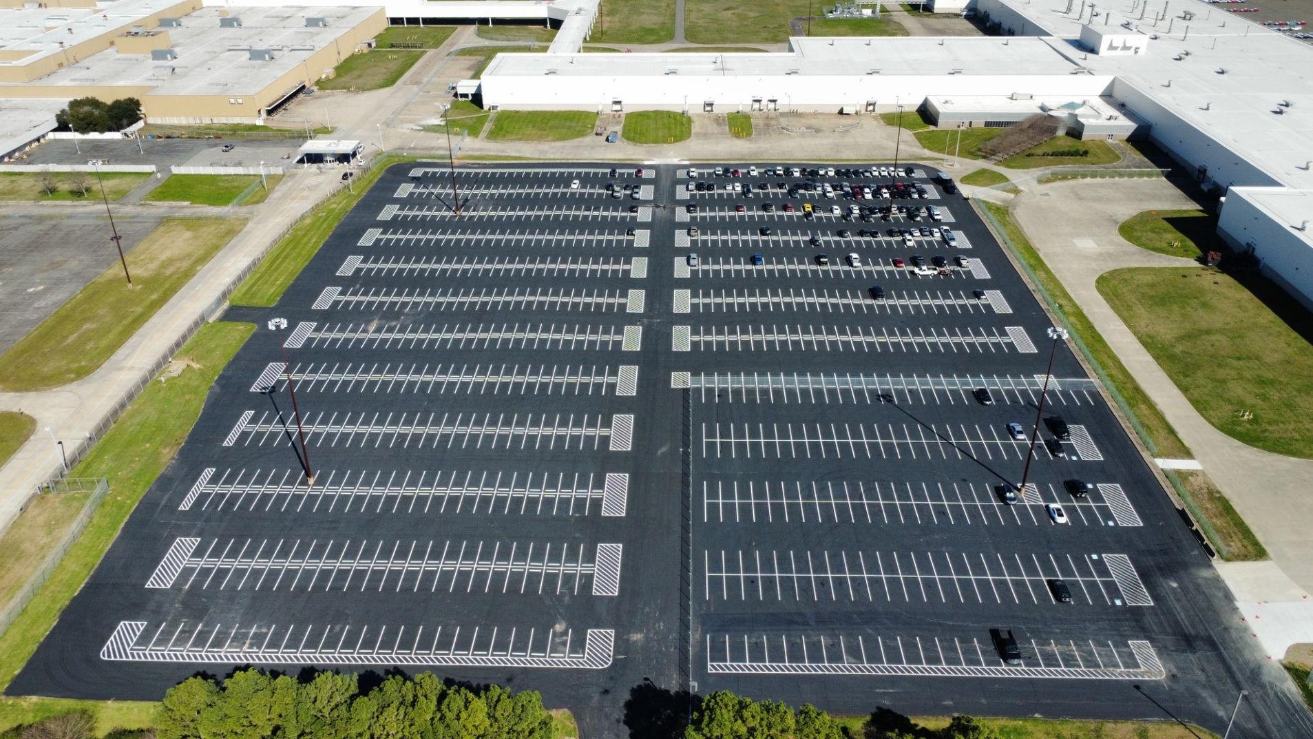 Aerial view of a freshly striped parking lot completed by Stripe Rite Services